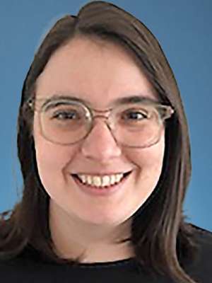 Smiling woman with glasses on blue background