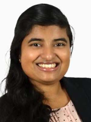 Jui Malwankar smiling professional headshot wearing blazer