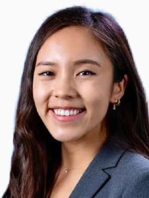 Elaine Chiao smiling headshot wearing a blazer