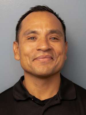 Phot of Julian in a black polo