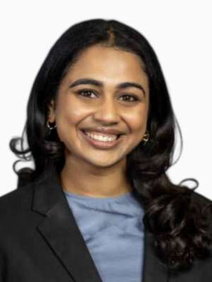 Meghna Gaddam smiling headshot wearing a blazer