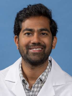 Mayank Patel, MD in white lab coat