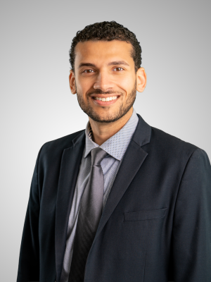 profile photo of Dr. Kozman smiling