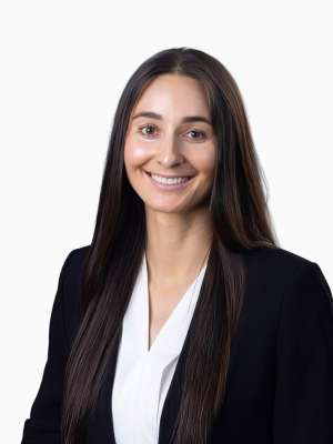 Mikayla Mefford, professional headshot, smiling in a blazer