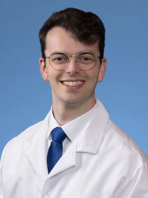 A headshot of John Miggins, MD