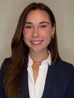 Head shot of Victoria Van Kirk, MD in business attire, smiling at camera.