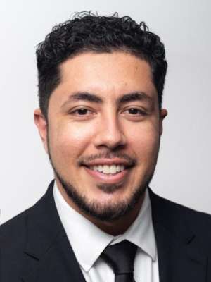 headshot of Antonio Casio-Zuleta in black suit