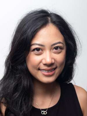 headshot of Grace Zhang in black shirt