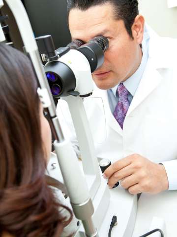 Eye doctor examining patient