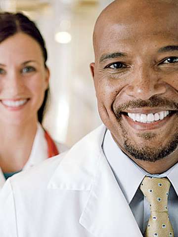 Doctor with co-worker in background