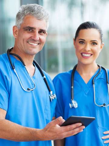 Medical doctors using tablet pc in hospital