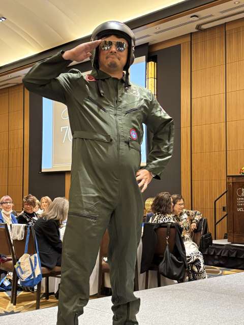 A man in the UCLA Thrift Shop fashion show.