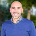 headshot of Marco Hidalgo in blue sweater