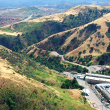 Aliso Canyon gas storage facility in the right foreground with the Porter Ranch neighborhood in the left background.