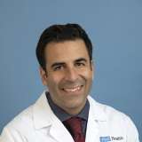 Jamil A. Aboulhosn, MD smiling portrait in white coat