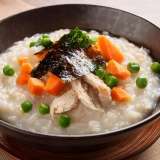 Rice Porridge in a Bowl with Carrots and Peas
