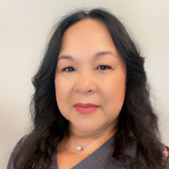 headshot of Yanina Venegas in floral blouse