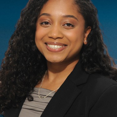 Dr. Rehana Persaud smiling at the camera