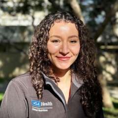 a headshot of Tatiana Romero wearing a grey UCLA Health jacket