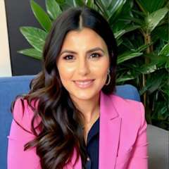 headshot of Katrina Barron in a pink blazer