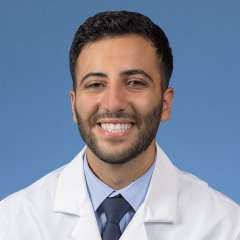 A headshot of George Mina, MD