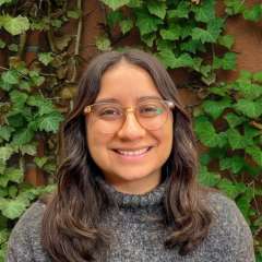 Headshot of Kimberly Ramirez wearing a grey sweater
