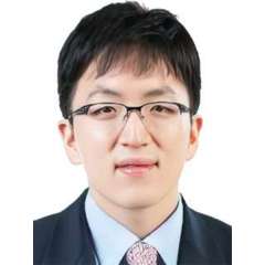 headshot of Dr. Brian Na in black suit