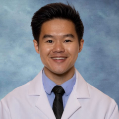 Headshot of Dr. Nilson Wu in front of a blue background