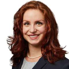 headshot of Dr. Christina Tripsas in black jacket.