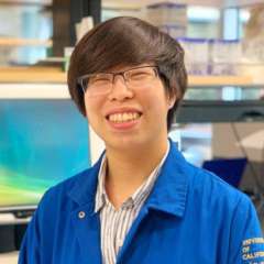 headshot of Jennifer Ego in a blue lab coat