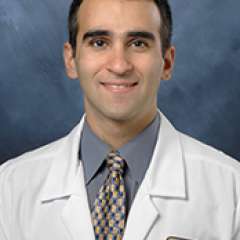 Headshot of Mark Goodarzi in white lab coat
