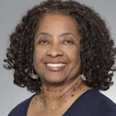 headshot of Aziz Lucas-Wright in dark blue blouse