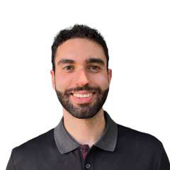Head shot of Nicholas Kopooshian, MD in a polo shirt, smiling at camera