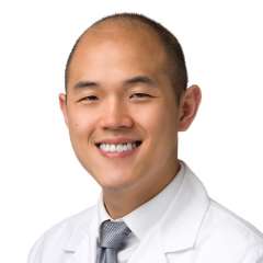 headshot of Dr. Michael Oh in white coat