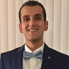 headshot of Dr. Samer Alkalis in suit and bow-tie