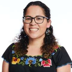 headshot of Cynthia Gonzalez in traditional floral shirt
