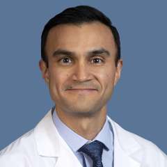 Michael C. Garcia, MD, professional headshot in white coat and tie.